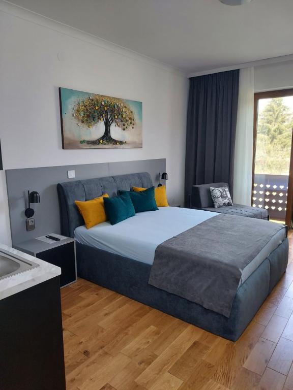 Postel nebo postele na pokoji v ubytování Guest House Vila Lujza