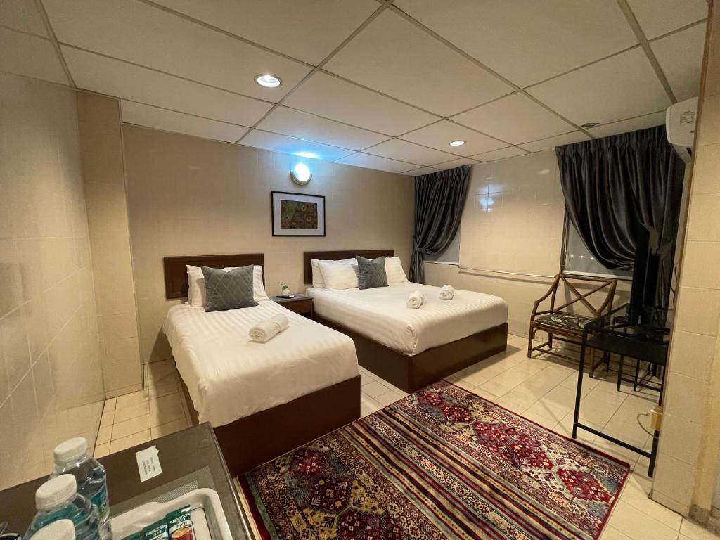 Postel nebo postele na pokoji v ubytování Barrack Street Hotel