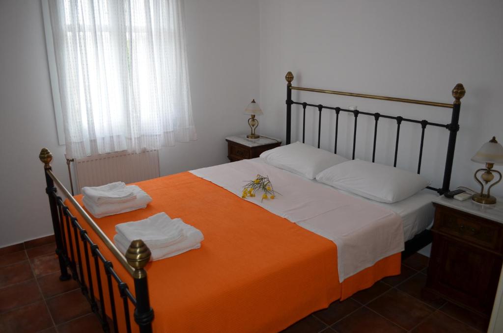 Postel nebo postele na pokoji v ubytování Maryianni Apartments