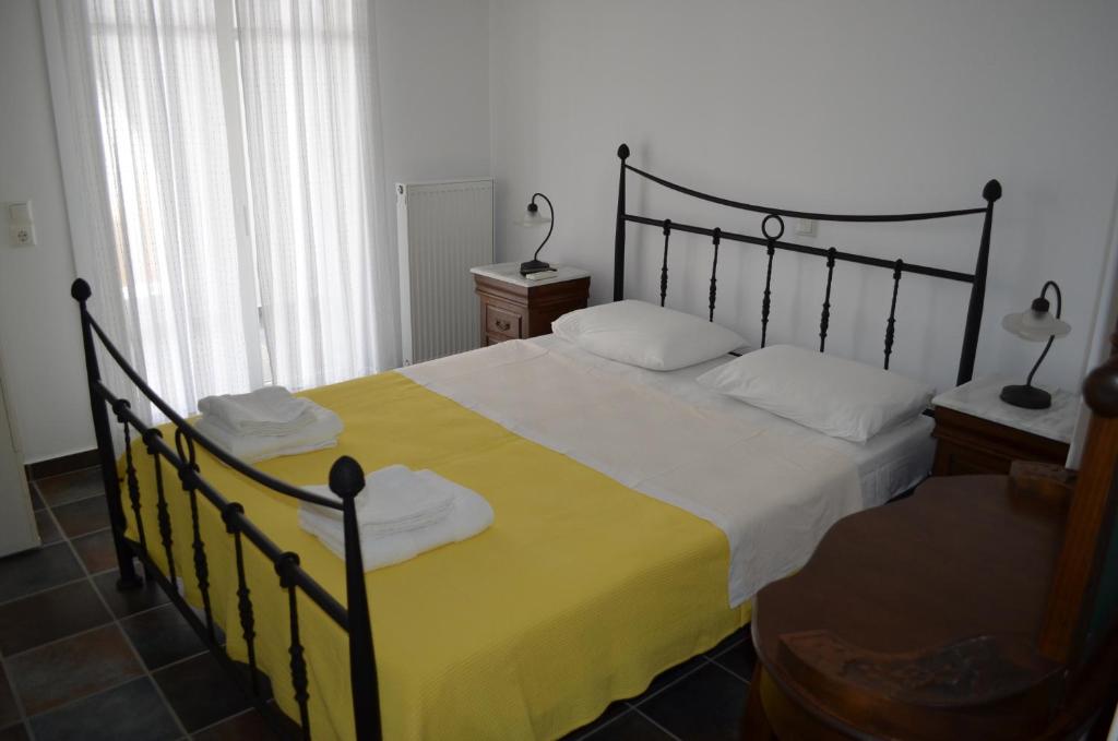 Postel nebo postele na pokoji v ubytování Maryianni Apartments