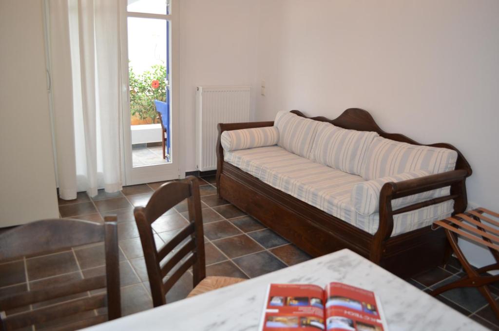 Postel nebo postele na pokoji v ubytování Maryianni Apartments