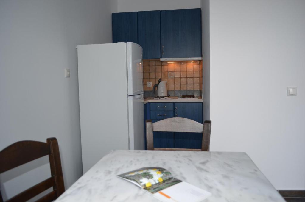 Postel nebo postele na pokoji v ubytování Maryianni Apartments