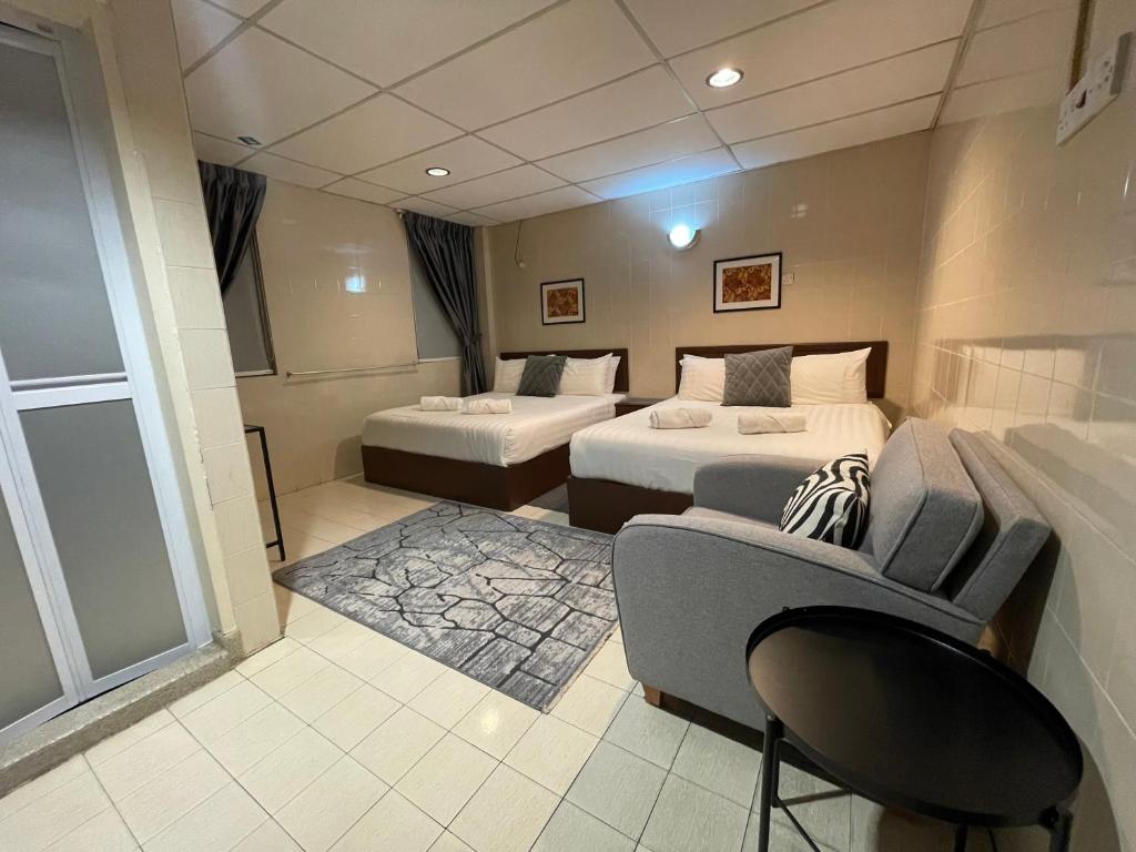 Postel nebo postele na pokoji v ubytování Barrack Street Hotel