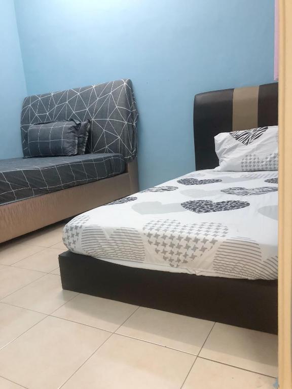 Postel nebo postele na pokoji v ubytování E&Y HOMESTAY