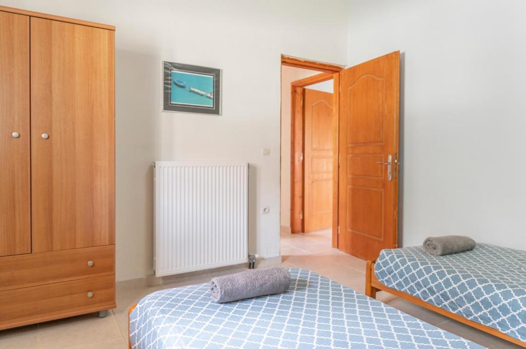 Posteľ alebo postele v izbe v ubytovaní Holiday House Zakynthos