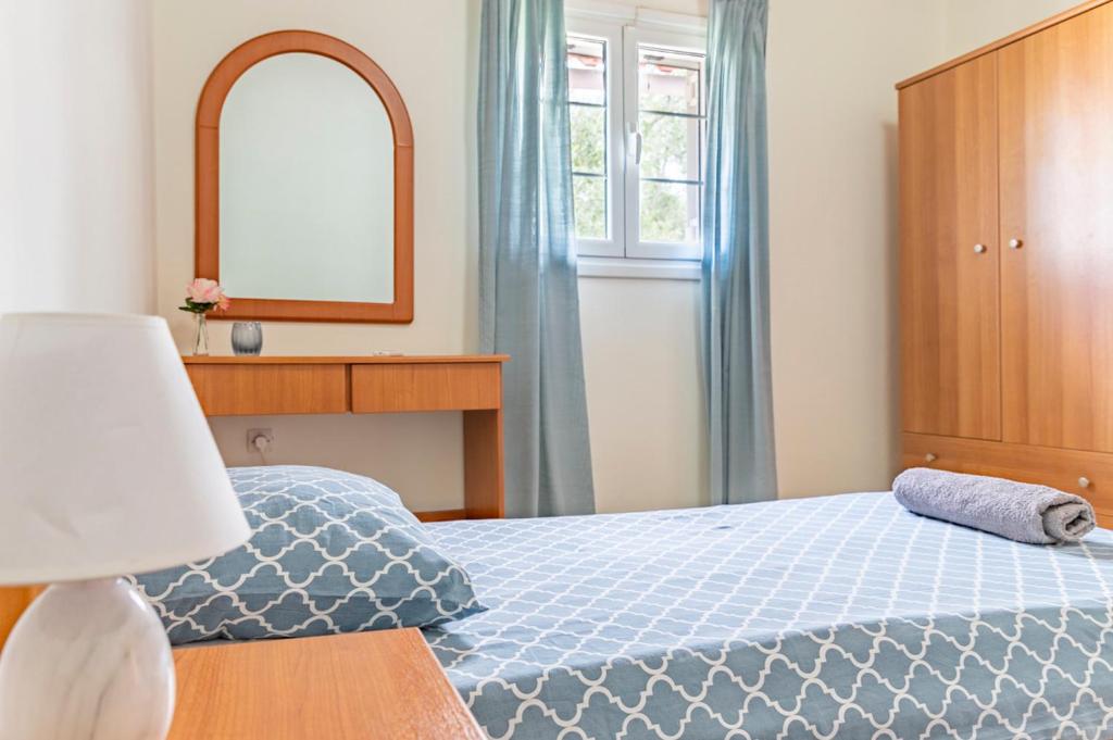 Posteľ alebo postele v izbe v ubytovaní Holiday House Zakynthos