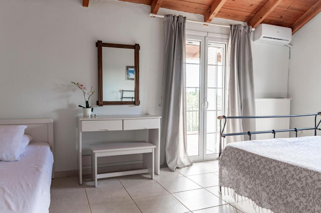 Posteľ alebo postele v izbe v ubytovaní Holiday House Zakynthos