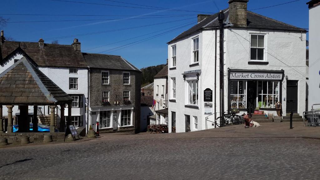 a street in a small town with a building at Town View Alston in Alston