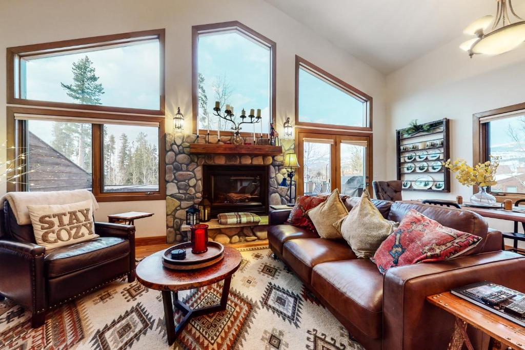 a living room with a couch and a fireplace at Elk Trail Retreat in Winter Park