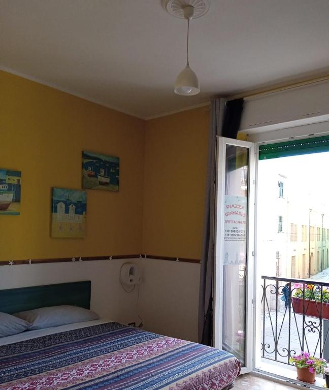 Postel nebo postele na pokoji v ubytování Piazza Ginnasio Affittacamere