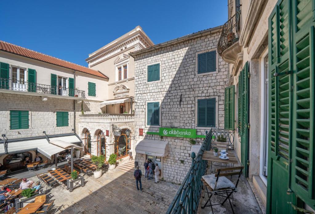 an overhead view of a street in a city with buildings at Main Square View in Kotor