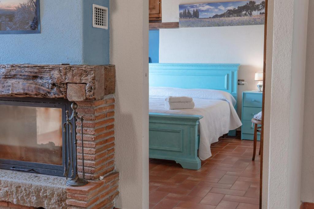 Postel nebo postele na pokoji v ubytování Agriturismo Cafaggio Primo