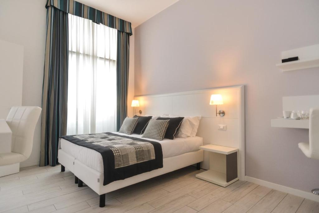 Łóżko lub łóżka w pokoju w obiekcie Lata Luxury Rooms