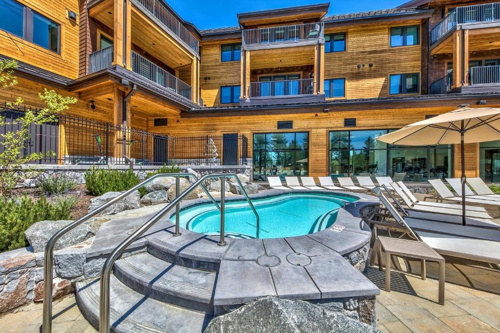 a pool in front of a building with a resort at Zalanta in South Lake Tahoe