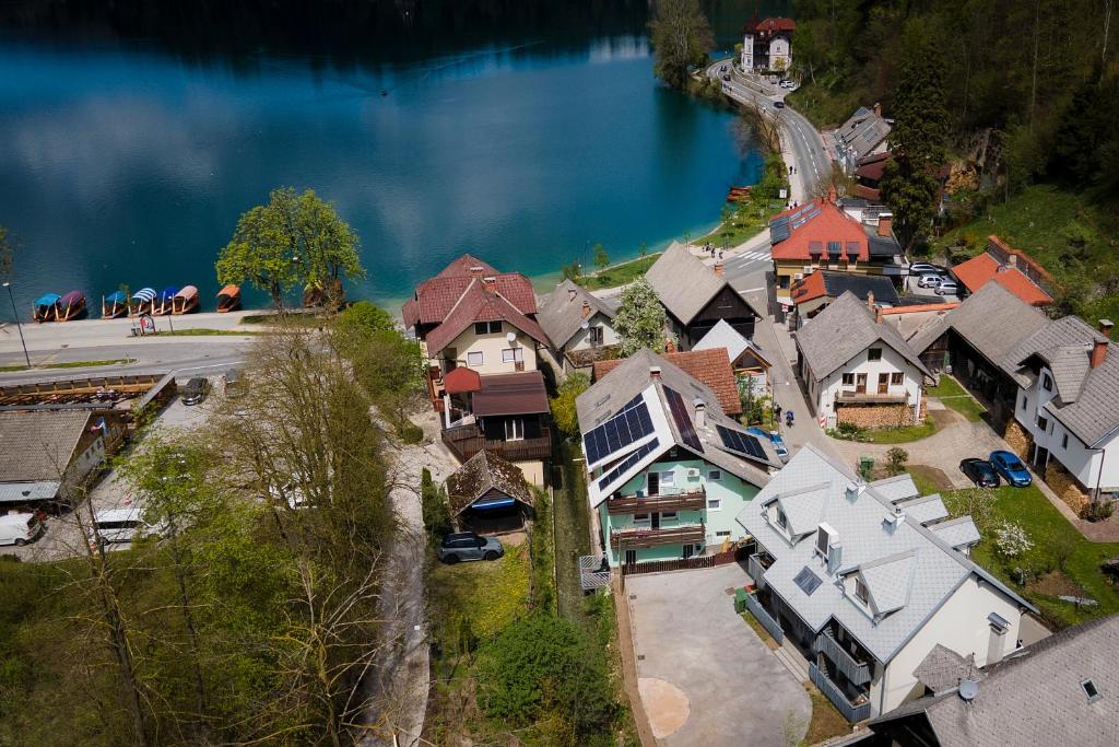 an aerial view of a town next to a lake at Lakeside Apartments Bled in Bled