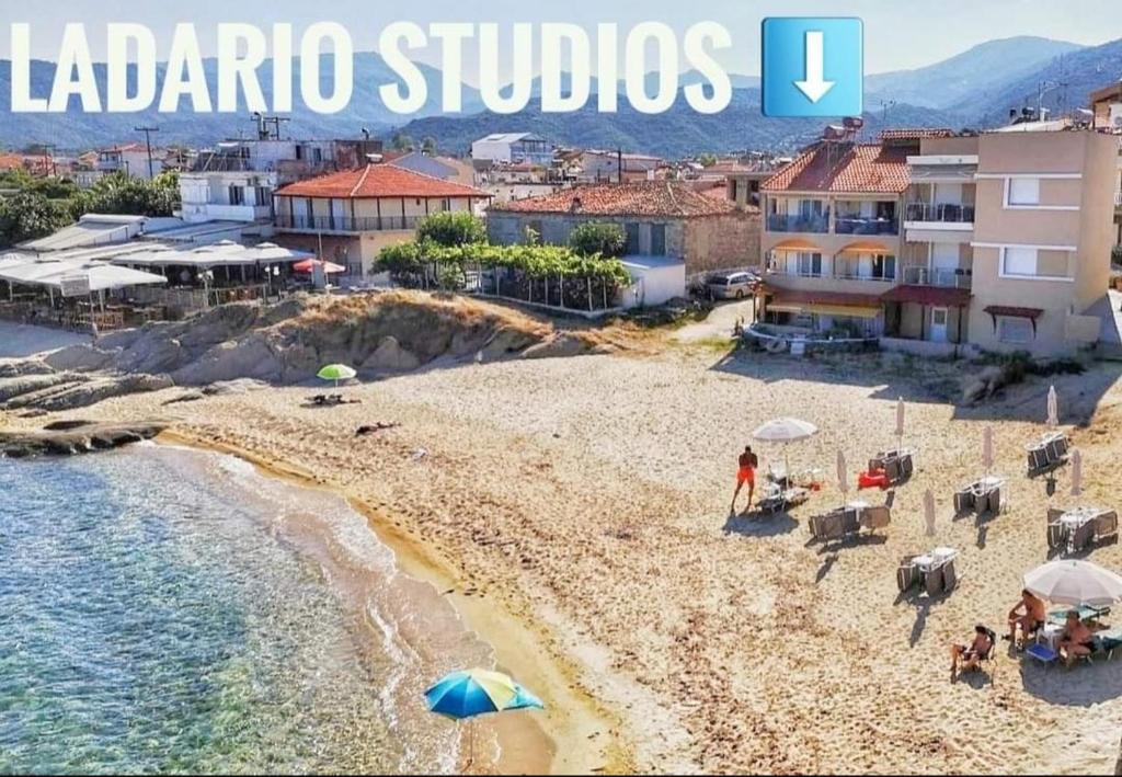 a view of a beach with buildings and the words la luna studios at Ladario Studios in Sarti