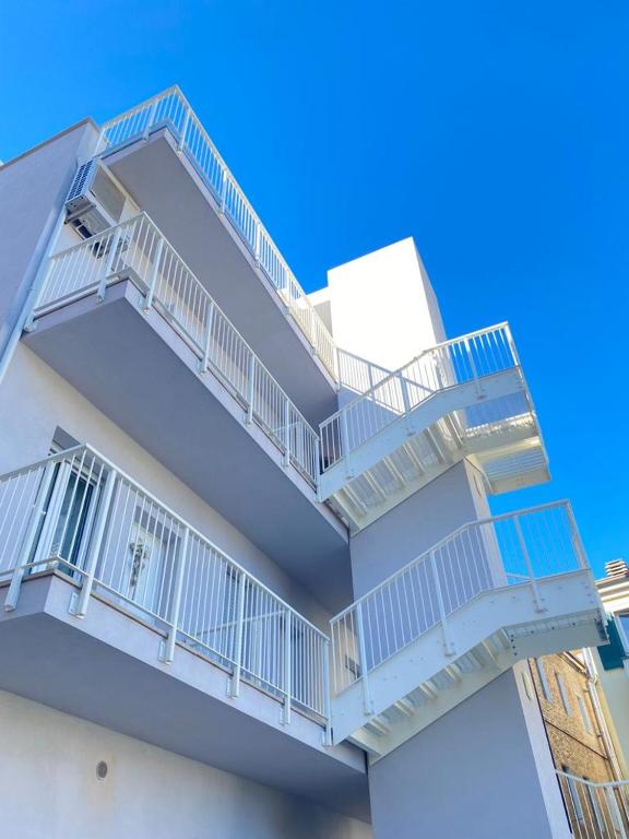a building with balconies on the side of it at NUOVO E CENTRALISSIMO in Civitanova Marche