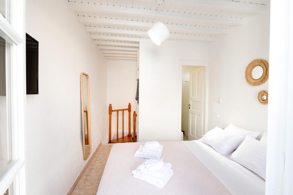 Postel nebo postele na pokoji v ubytování MYKONOS HOUSE Eternity maisonette , Mykonos Town
