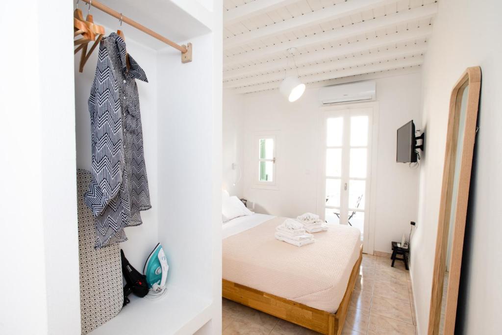 Postel nebo postele na pokoji v ubytování MYKONOS HOUSE Eternity maisonette , Mykonos Town