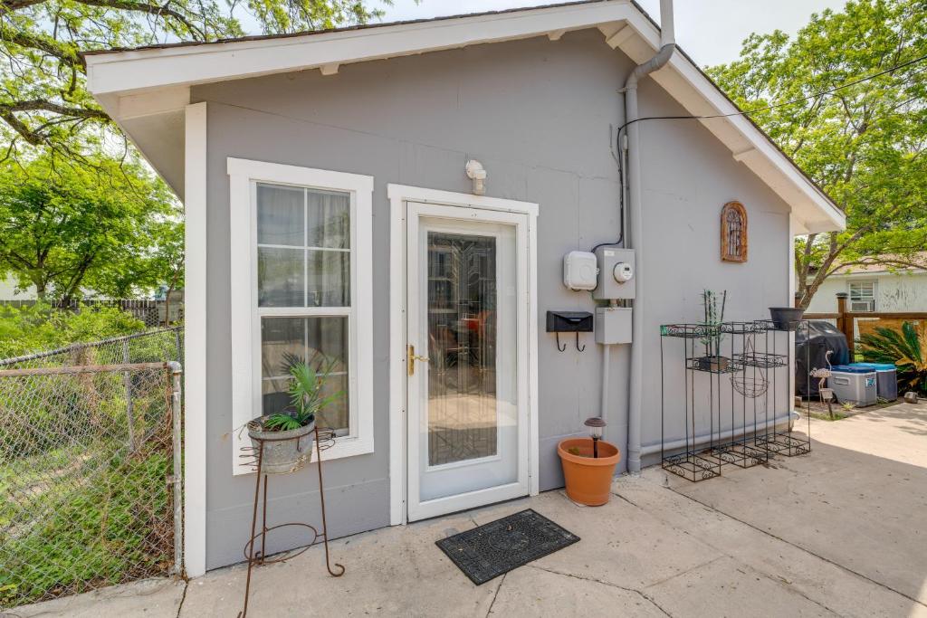 a tiny house with a door and a fence at Cozy and Convenient San Antonio Home 5 Mi to Dtwn! in San Antonio
