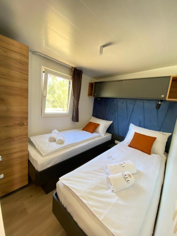 Postel nebo postele na pokoji v ubytování Mobile Homes MaLu