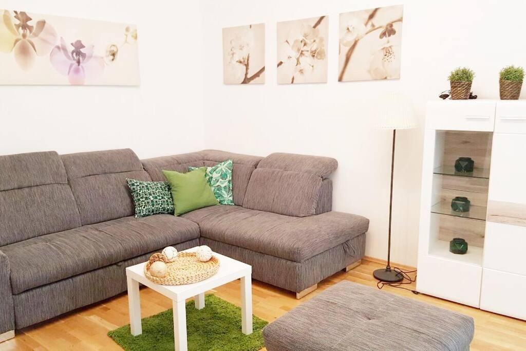 a living room with a couch and a table at Relax Apartment Vienna City Center in Vienna