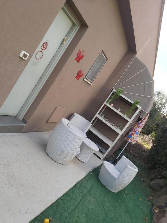 two toilets sitting outside of a house at ZEHAVI Guest House in Lahavot HaBashan