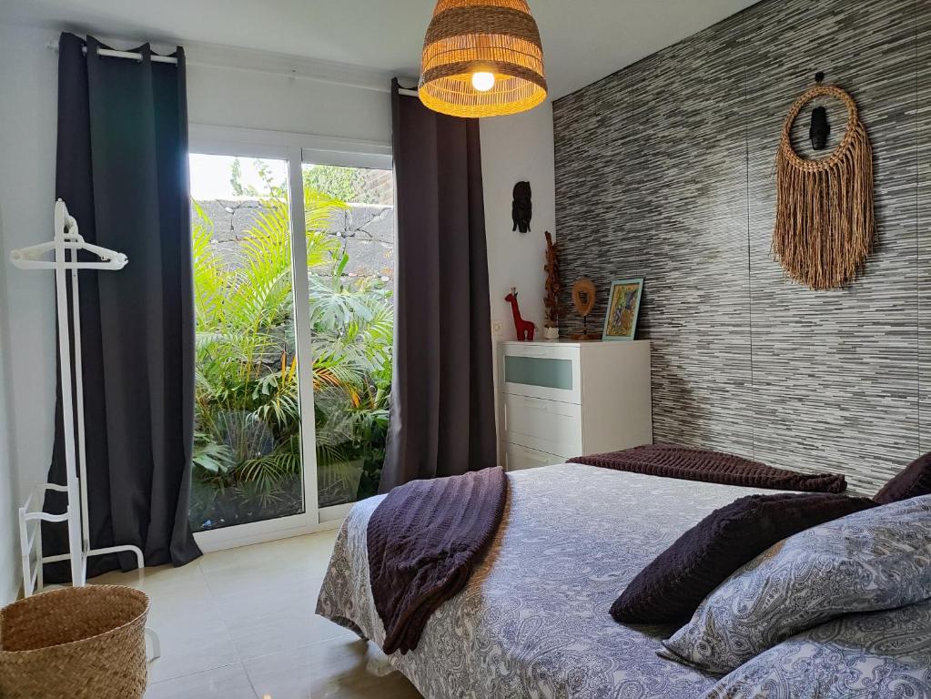 Ein Bett oder Betten in einem Zimmer der Unterkunft Love for Lanzarote holidays house