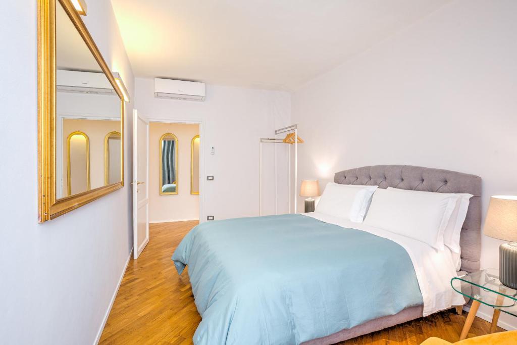 A bed or beds in a room at Condotta 16 Apartments