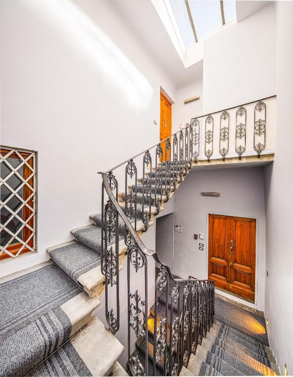 A bed or beds in a room at Condotta 16 Apartments