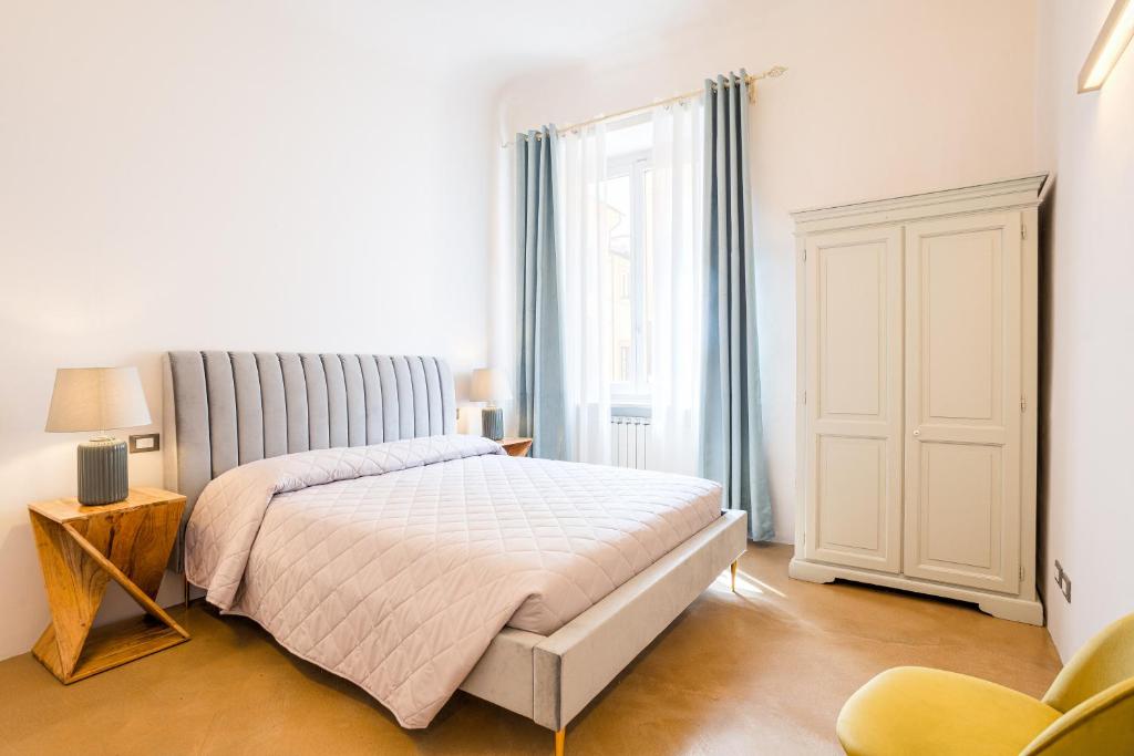 A bed or beds in a room at Condotta 16 Apartments