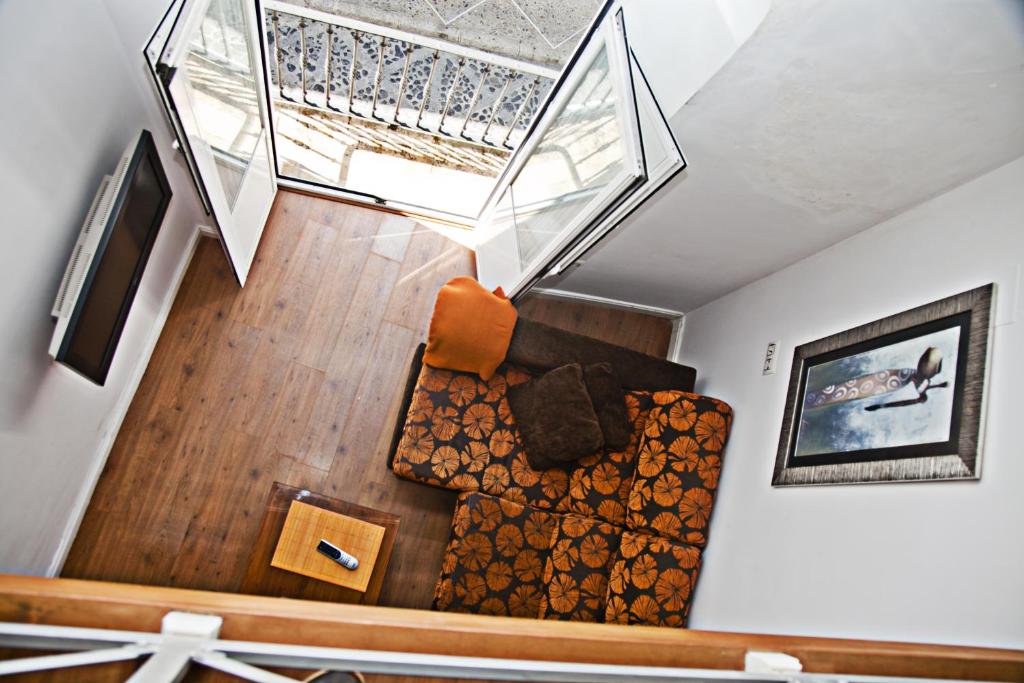 TV a/nebo společenská místnost v ubytování Apartamentos La Casa de la Alameda