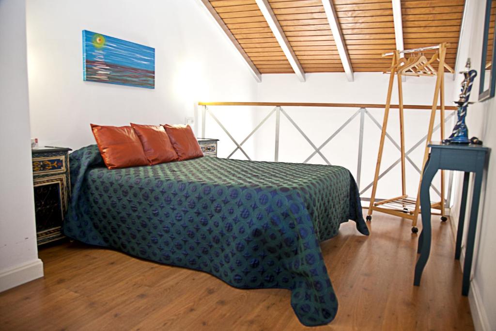 Postel nebo postele na pokoji v ubytování Apartamentos La Casa de la Alameda