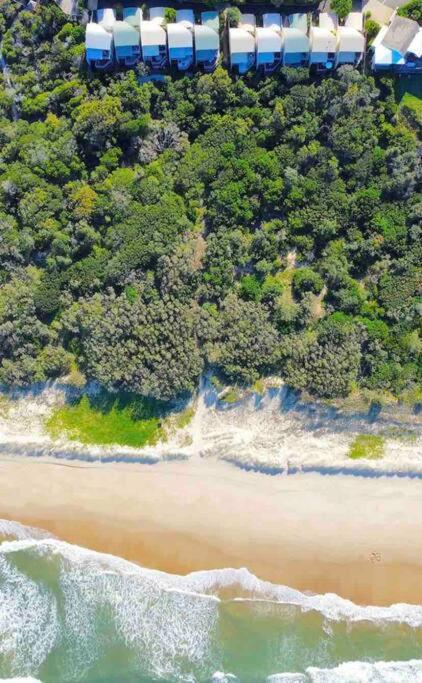 an aerial view of the beach and the ocean at Castaways Beach House Noosa in Marcus Beach