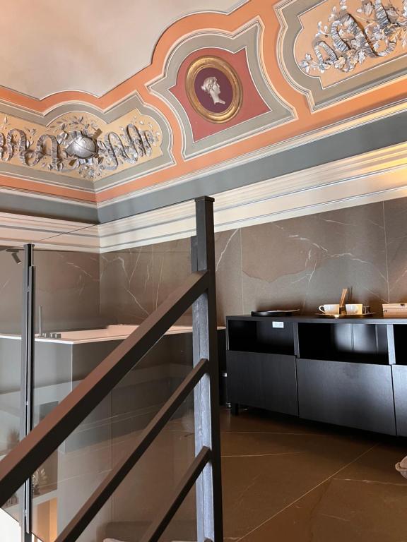 A bed or beds in a room at Duomo Housing Catania Le Suites