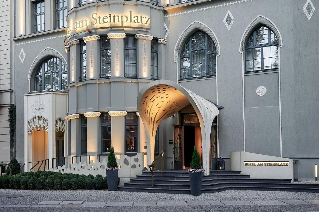 a building with a sign on the front of it at Hotel am Steinplatz, Autograph Collection in Berlin