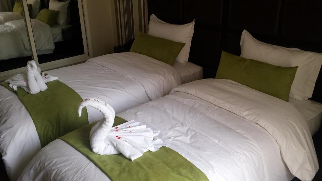 Postel nebo postele na pokoji v ubytování Hotel Swani