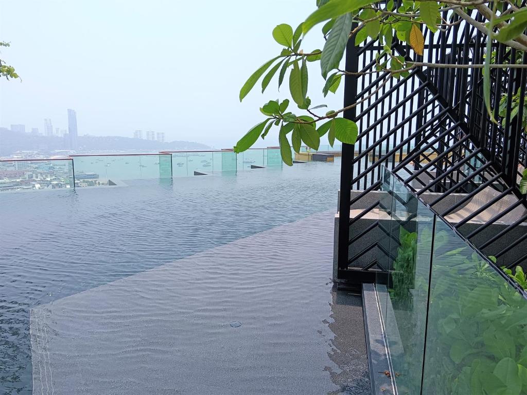 a body of water with a bridge in the background at Edge Central Pattaya Lux in Pattaya Central