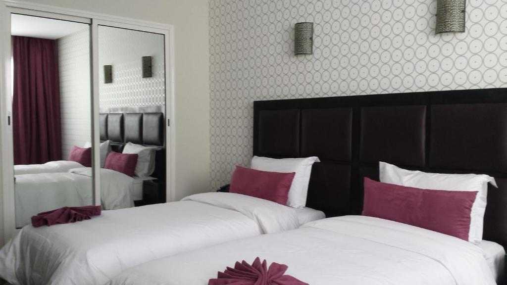 Postel nebo postele na pokoji v ubytování Hotel Swani