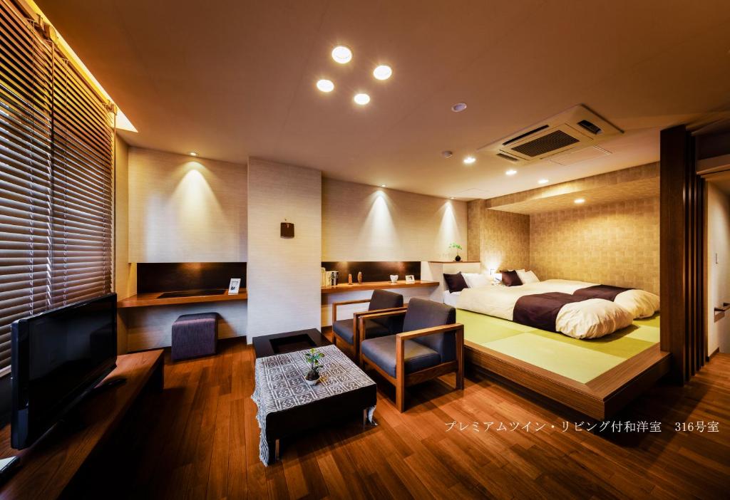 TV a/nebo společenská místnost v ubytování Hotel Oyanagi