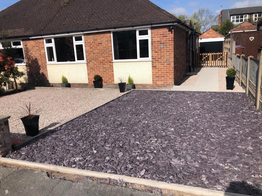 a driveway with gravel in front of a house at 2 Bedroom Bungalow in Mawdesley