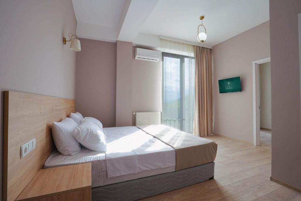 Postel nebo postele na pokoji v ubytování Tilia Kvareli Resort