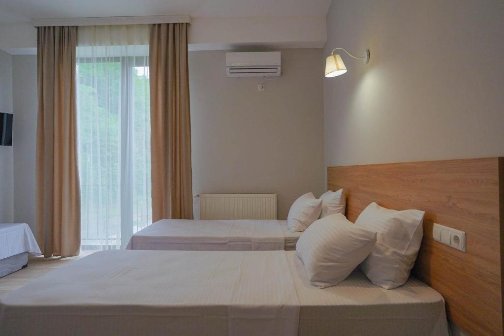 Postel nebo postele na pokoji v ubytování Tilia Kvareli Resort