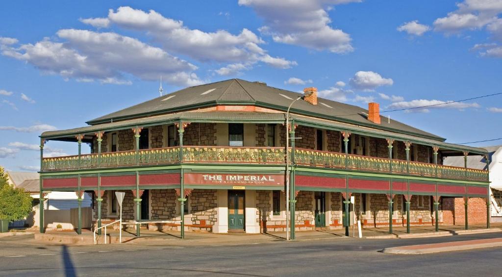 a building on the corner of a street at Imperial Fine Accommodation in Broken Hill