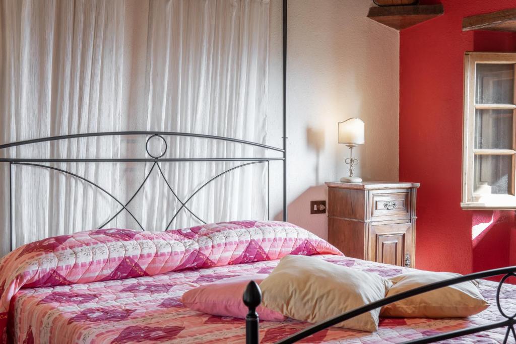 Postel nebo postele na pokoji v ubytování Agriturismo Cafaggio Primo