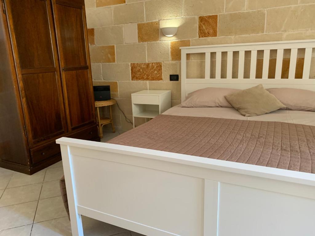 Säng eller sängar i ett rum på Apt Riviera degli Haethey