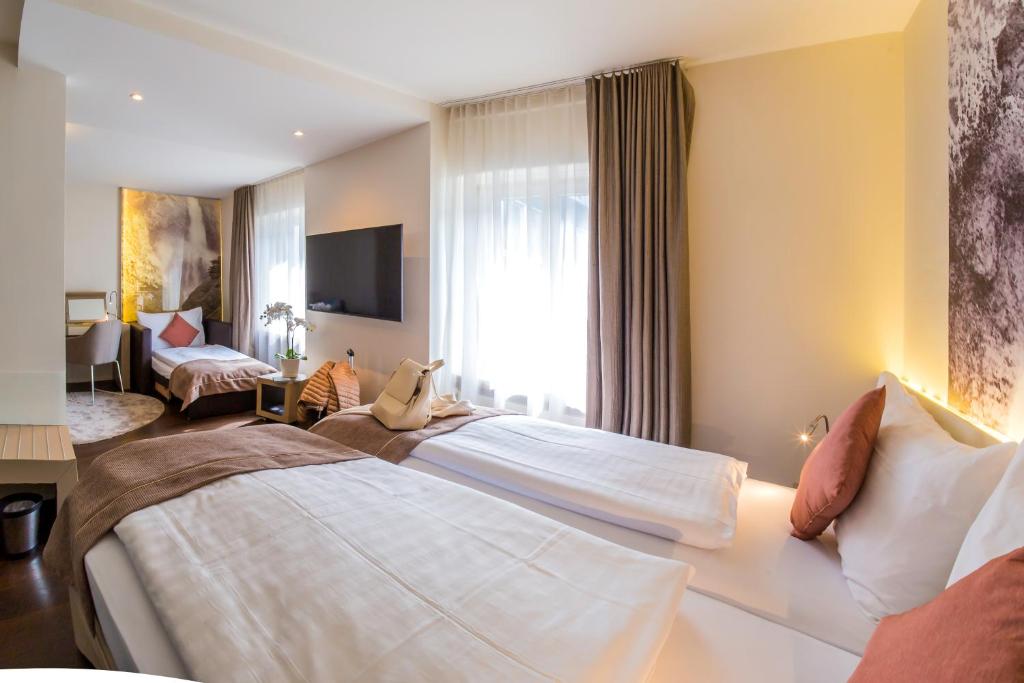 Postel nebo postele na pokoji v ubytování Cascada Boutique Hotel