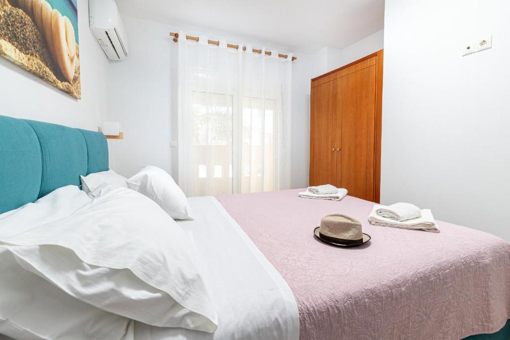 Postel nebo postele na pokoji v ubytování Sun Beach Apartments