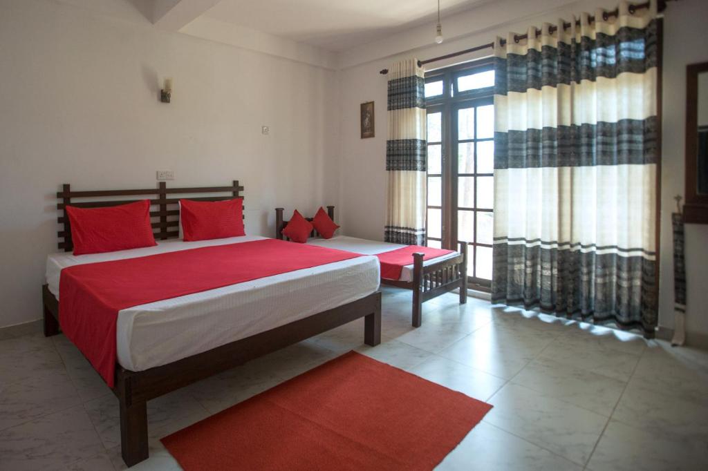 Postel nebo postele na pokoji v ubytování Kandy Fortress