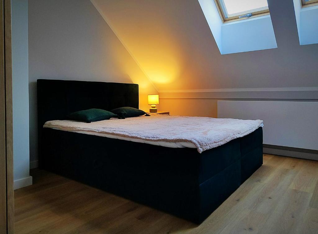 Postel nebo postele na pokoji v ubytování Hugo Eden Apartments